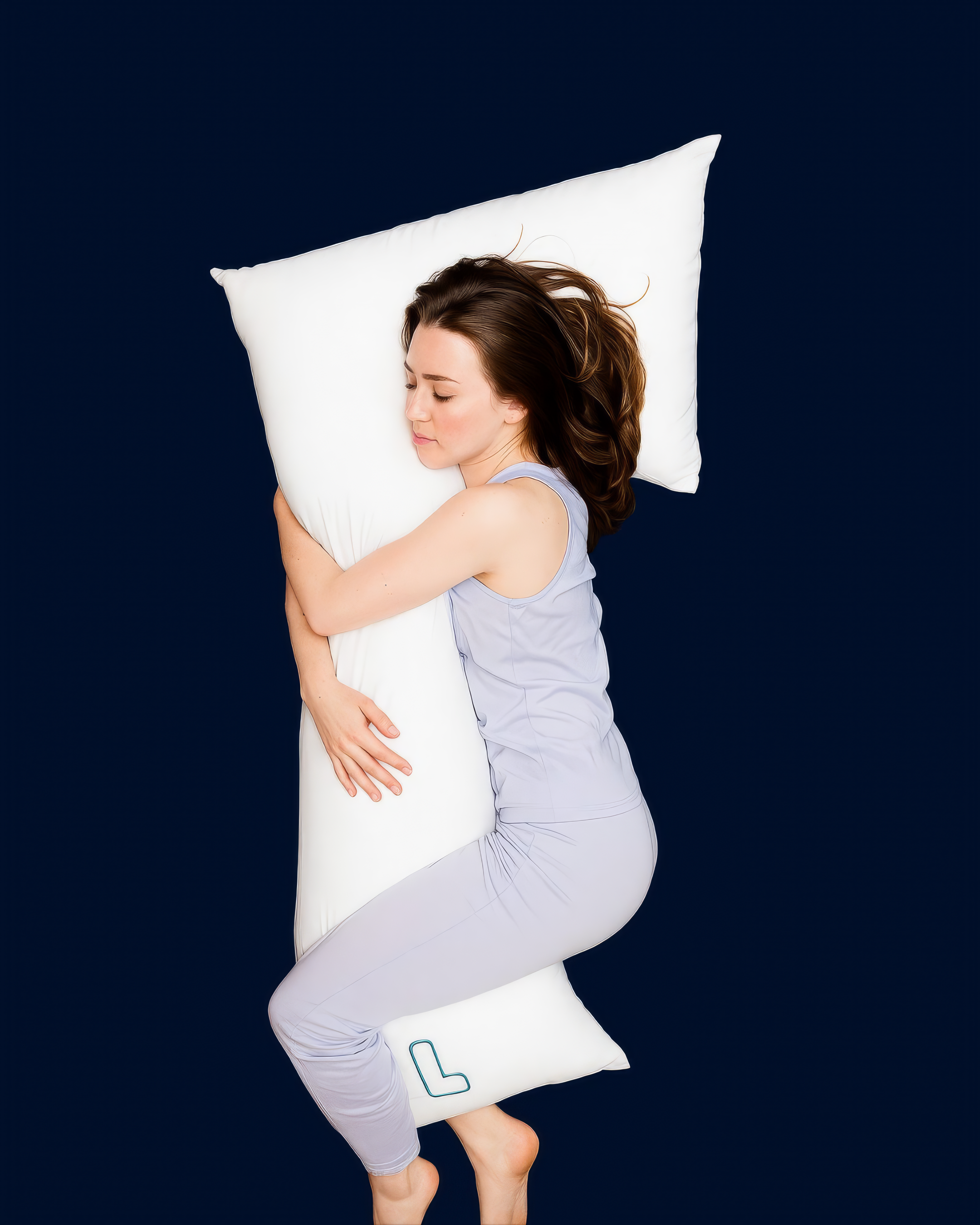 Woman resting on the snuggL L-shaped pillow